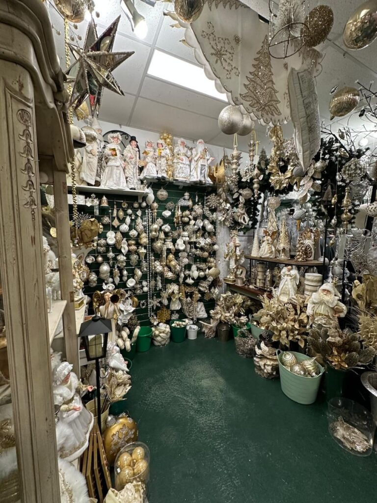 Gold and white sacred themed Christmas ornaments display at Bredbo Christmas Barn