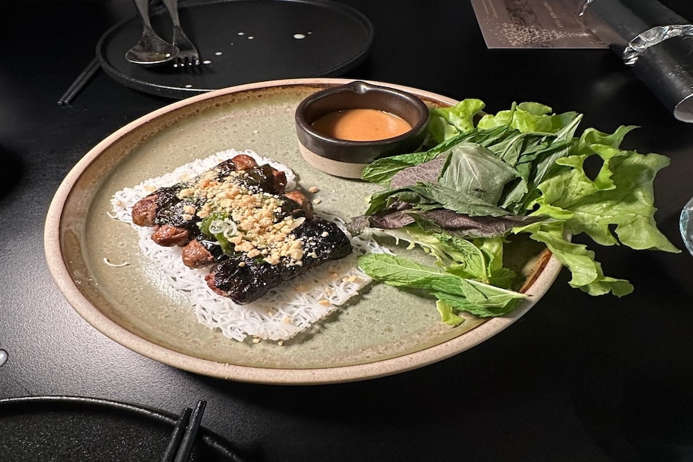 Wagyu Beef La Lot served with fresh herbs and creamy peanut sauce
