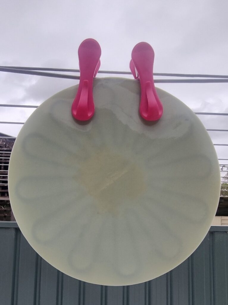 Stained silicon lid hanging outside