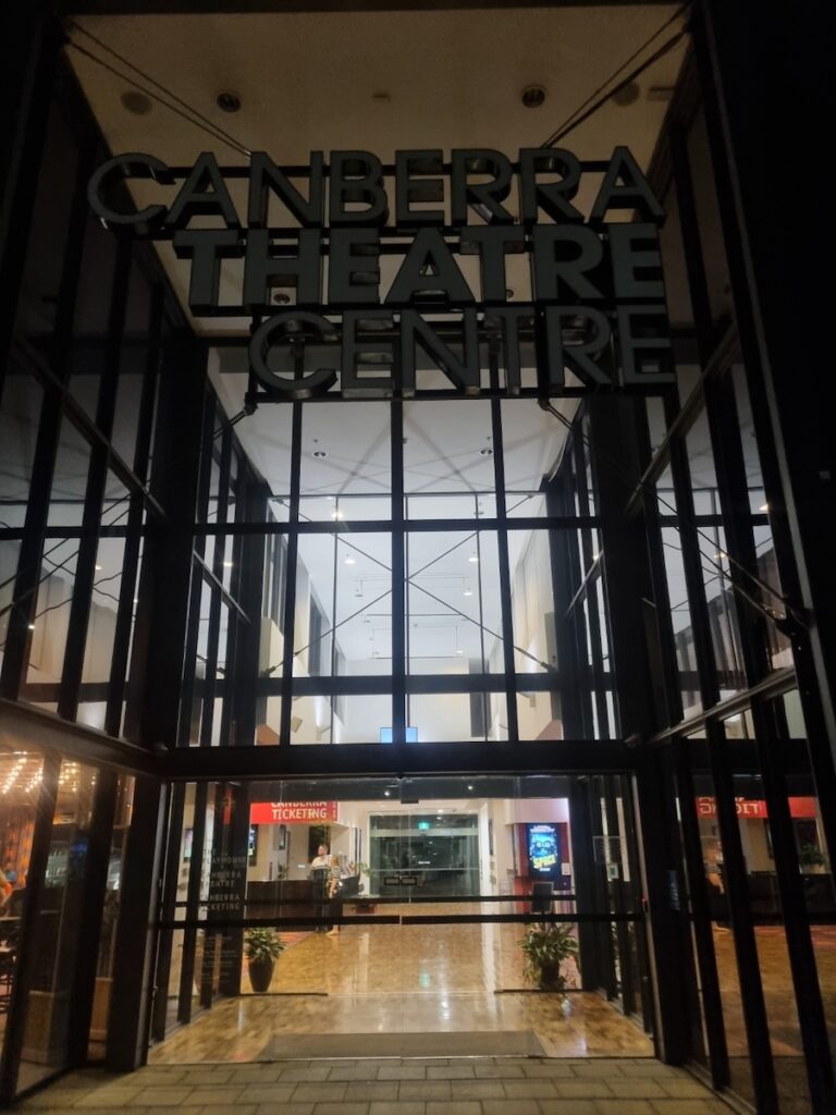 An official sign for the Drum Tao 2026 Australia Tour at the entrance of the Canberra Theatre Centre.