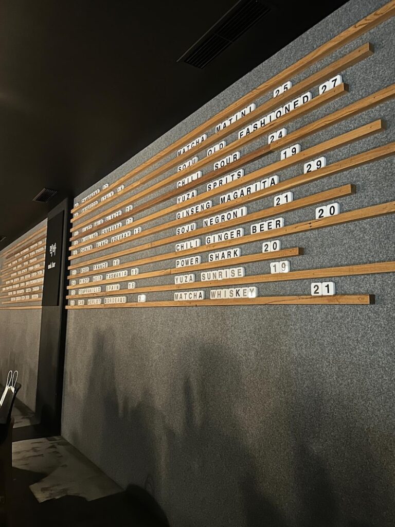 Drink menu displayed as wall decoration at Mukbar Barton in Canberra